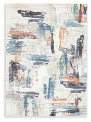 Ashley Furniture Hessland washable rug with a modern geometric pattern in neutral tones, perfect for living room or bedroom decor.