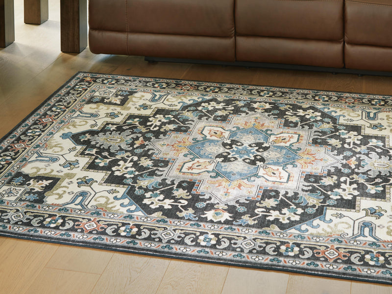 Ashley Furniture Leningston washable rug with a patterned design in neutral tones, 4x3 feet, cropped view.