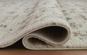 Close-up of Ashley Furniture Jossler Rug with detailed woven pattern and textured surface in neutral tones.
