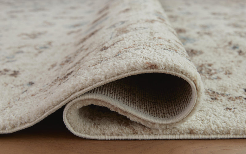 Close-up of Ashley Furniture Jossler Rug with detailed woven pattern and textured surface in neutral tones.