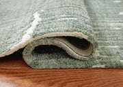 Close-up of the Ashley Furniture Cayworth Rug showing intricate pattern and soft texture in neutral tones.
