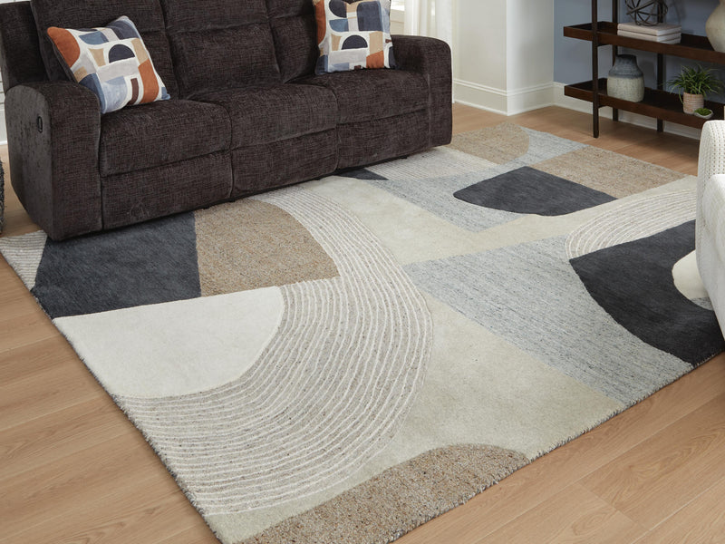 Large 8x10 Ashley Furniture Edrickhill rug featuring intricate patterns and warm tones, ideal for living room or bedroom decor.