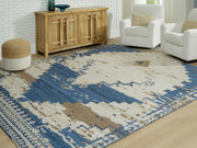 Ashley Furniture Varnler Rug with intricate pattern in warm tones, cropped view showing detailed woven texture.