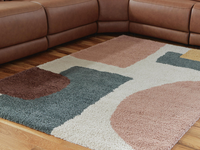 Large Ashley Furniture Flynnwick 8x10 rug with intricate pattern and soft texture, suitable for living room or bedroom decor.