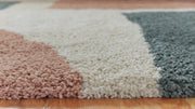 Close-up of Flynnwick Rug by Ashley Furniture, showcasing detailed woven texture and soft neutral tones.