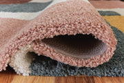 Ashley Furniture Flynnwick 5' x 7' medium rug with intricate pattern and soft texture, detailed close-up view.