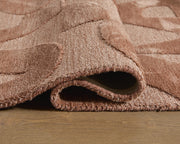 Close-up of the Ashley Furniture Perrenton rug showing detailed woven pattern and rich texture in a natural indoor setting.