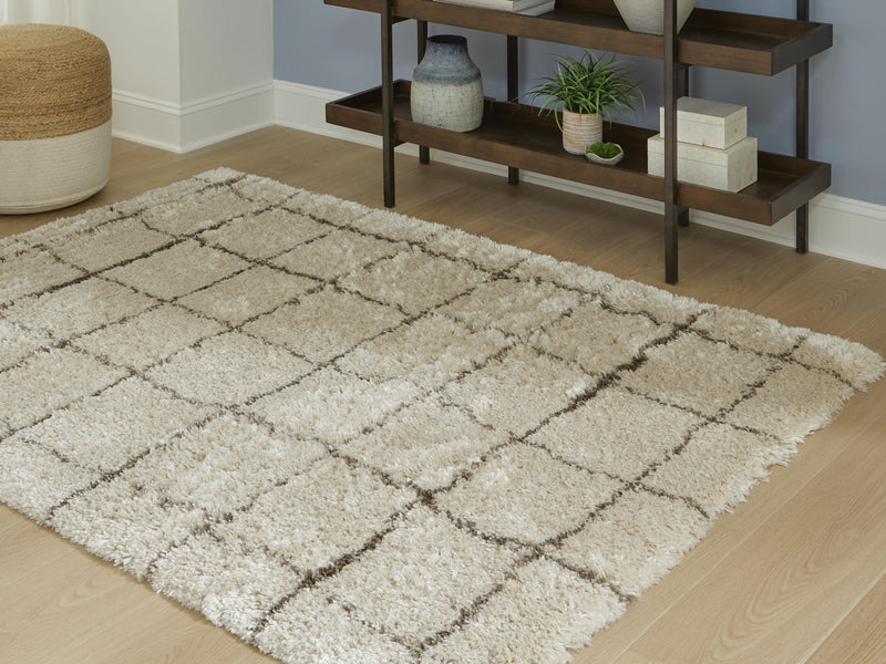 Ashley Furniture Wrenlow Rug in 4x3 feet, showcasing a textured, neutral-toned woven design suitable for living room or bedroom decor.