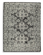 Medium Ashley Furniture Glennisman rug featuring a detailed, textured design in neutral tones, ideal for living room or bedroom decor.