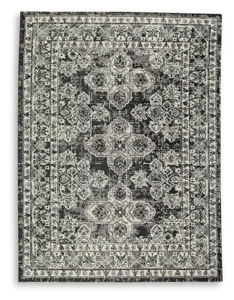 Medium Ashley Furniture Glennisman rug featuring a detailed, textured design in neutral tones, ideal for living room or bedroom decor.