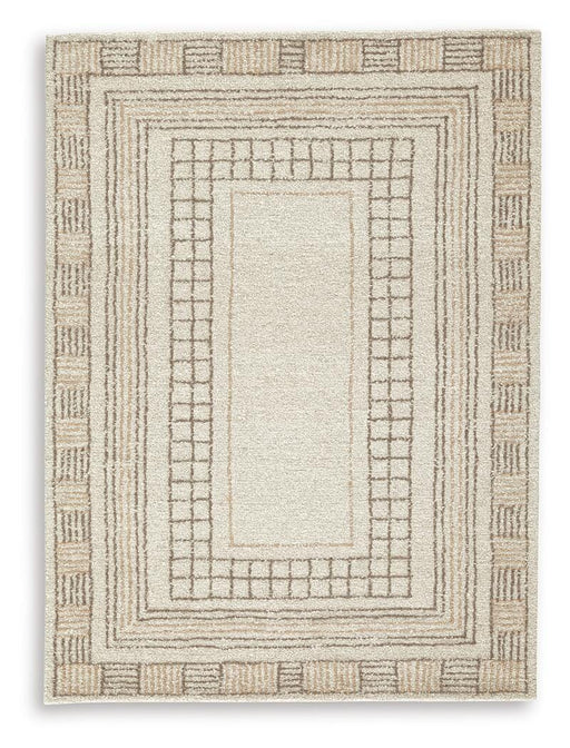 Ashley Furniture Idaman Rug with intricate patterns in neutral tones, shown on a hardwood floor.