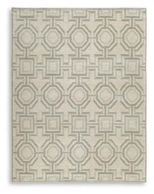 Large Maconville Rug by Ashley Furniture featuring a soft, textured design in neutral tones for living room or bedroom decor.