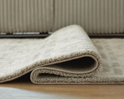 Close-up of the Maconville Medium Rug from Ashley Furniture, showcasing its detailed woven pattern and soft texture.
