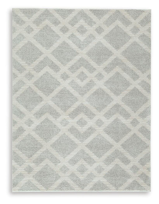 Medium Ashley Furniture Unawick Rug with intricate pattern in neutral tones, showcasing soft woven texture and stylish design.