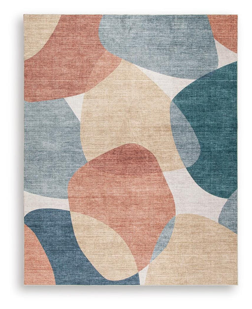 Large Ashley Furniture Chanleigh washable area rug, 7'6" x 9'6", with intricate pattern and soft texture, ideal for living rooms.