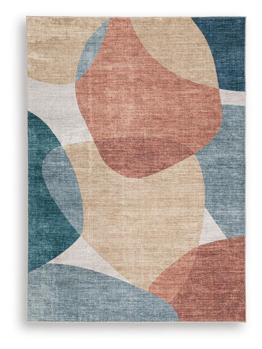Medium Ashley Furniture Chanleigh washable 5x7 area rug with a soft, intricate pattern, suitable for living rooms or bedrooms.