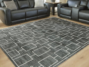 Large Ashley Furniture Elderland washable area rug, 7'6" x 9'6", with detailed pattern and soft texture visible in the image.