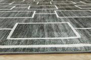 Large Ashley Furniture Elderland washable area rug, 7'6" x 9'6", with detailed pattern and soft texture, suitable for living rooms and bedrooms.
