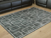 Elderland washable 5x7 medium area rug by Ashley Furniture with intricate pattern, perfect for living room or bedroom decor.