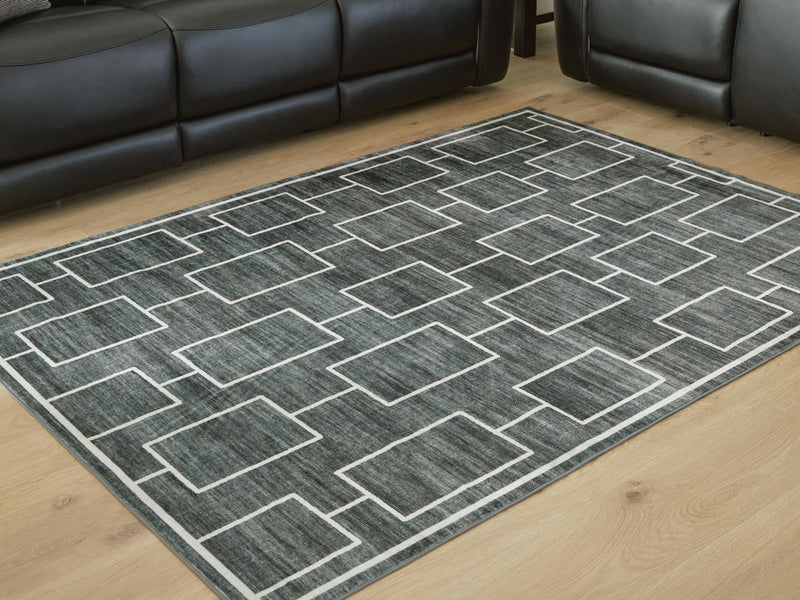 Elderland washable 5x7 medium area rug by Ashley Furniture with intricate pattern, perfect for living room or bedroom decor.