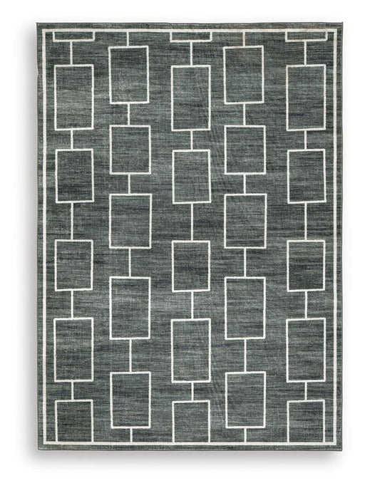 Medium Ashley Furniture Elderland washable 5' x 7' area rug with a soft, patterned design on a neutral background.
