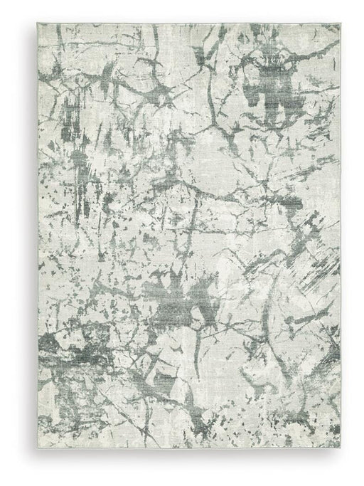 Medium Ashley Furniture Tobinbury washable area rug with a soft, patterned design suitable for living rooms or bedrooms.