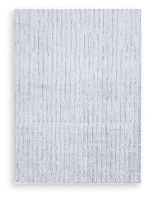 Medium Worthley washable area rug by Ashley Furniture featuring a soft, durable fabric in a stylish design.
