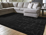 Large Ashley Furniture Gibbswell washable area rug, 8x10 feet, with intricate patterns and soft texture visible in the image.