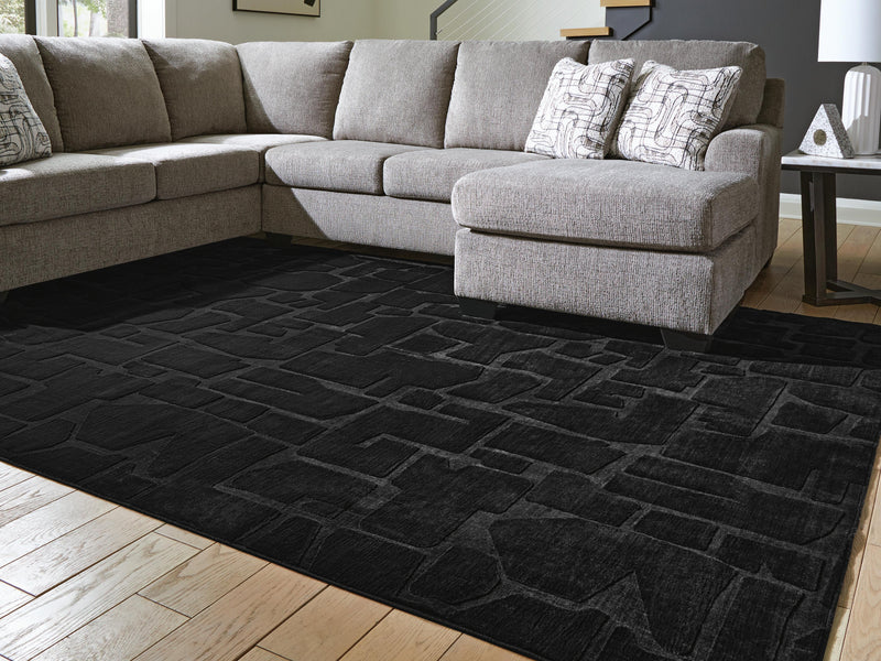 Large Ashley Furniture Gibbswell washable area rug, 8x10 feet, with intricate patterns and soft texture visible in the image.