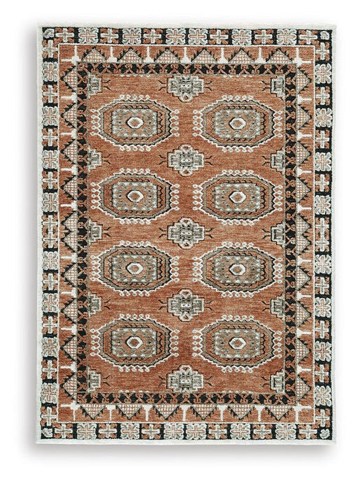 Medium Ashley Furniture Qaabiz Area Rug with intricate patterns, showcasing soft textures and stylish design.
