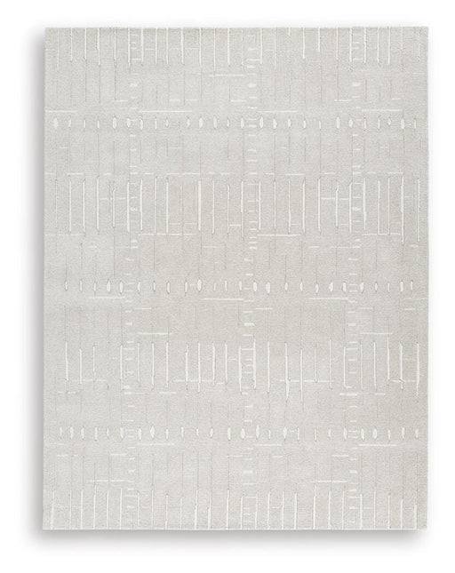 Large Ashley Furniture Wolbert 7'8" x 10' area rug with intricate pattern and soft texture, perfect for living rooms or bedrooms.