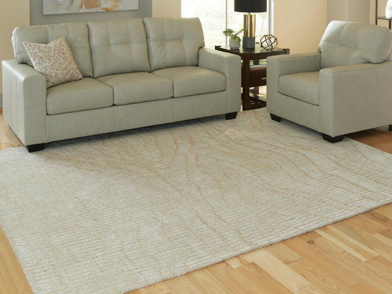 Ashley Furniture Jaseena area rug with a modern geometric pattern in neutral tones, perfect for contemporary living spaces.