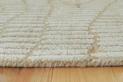 Close-up of the Ashley Furniture Jaseena Area Rug showing intricate pattern and soft texture in neutral tones.