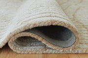 Ashley Furniture Jaseena area rug with intricate floral patterns in beige and blue tones, showcasing soft woven texture.