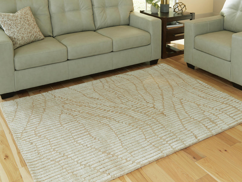 Ashley Furniture Jaseena Area Rug with intricate pattern, 4x3 feet, showcasing its soft texture and stylish design.
