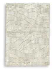 Ashley Furniture Jaseena area rug with intricate patterns in neutral tones, perfect for living room or bedroom decor.