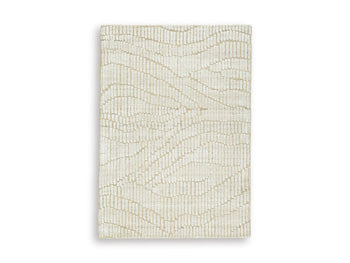 Ashley Furniture Jaseena area rug featuring a modern geometric pattern in neutral tones, perfect for contemporary home decor.