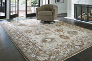 Ainswick memory foam rug by Ashley Furniture featuring plush, textured surface in neutral tones for cozy room decor.