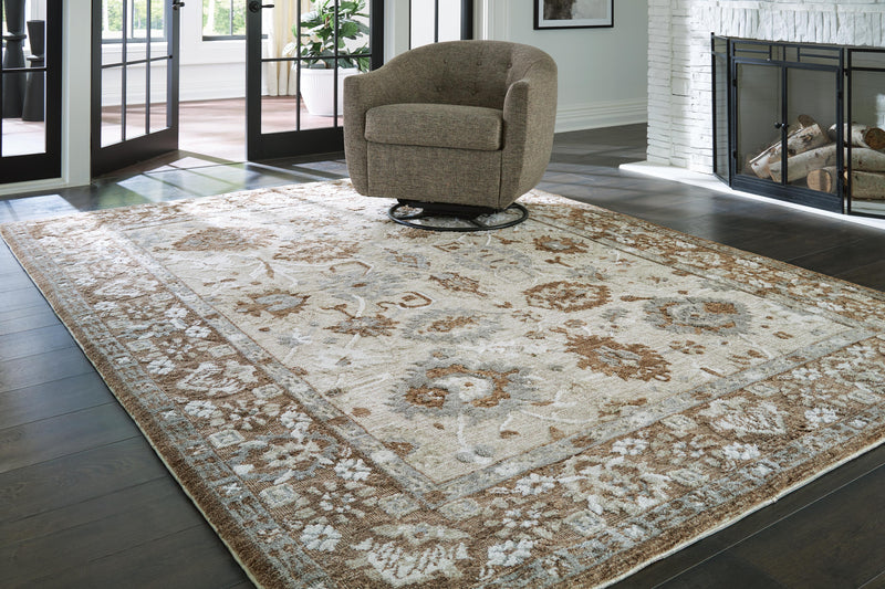 Ainswick memory foam rug by Ashley Furniture featuring plush, textured surface in neutral tones for cozy room decor.