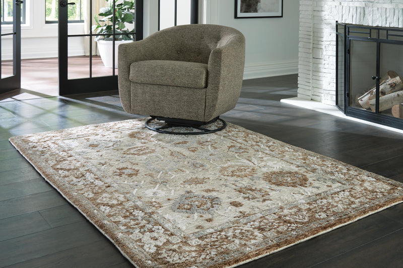 Ainswick memory foam rug from Ashley Furniture, showing a plush, textured rug with soft memory foam surface in neutral tones.