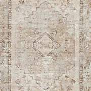 Swatch of Ashley Furniture Livdon washable rug featuring a soft, patterned fabric in neutral tones for living room decor.