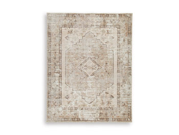 Ashley Furniture Livdon washable rug with a soft, patterned design in neutral tones, ideal for living room or bedroom decor.
