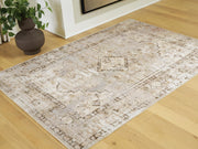 Ashley Furniture Livdon washable rug featuring a soft, durable fabric with a modern pattern in neutral tones.