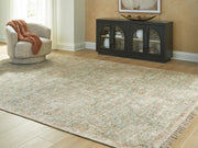 Cropped close-up of the Ashley Furniture Rossbury Rug featuring a textured, neutral-toned woven pattern.