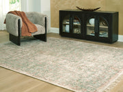 Ashley Furniture Rossbury Rug with a textured, neutral-colored design, shown in a close-up view.