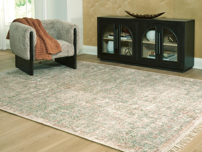 Ashley Furniture Rossbury Rug with a textured, neutral-colored design, shown in a close-up view.