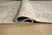 Close-up of the Ashley Furniture Rossbury Rug, showcasing its detailed woven pattern and rich texture.