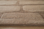 Close-up of the Ashley Furniture Orest Rug showcasing its detailed woven pattern and textured surface.