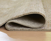 Close-up of Ashley Furniture Neroham Rug showing detailed woven pattern and soft texture in neutral tones.