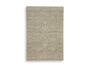 Ashley Furniture Neroham Rug featuring a textured, woven design in neutral tones, perfect for adding warmth to any living space.